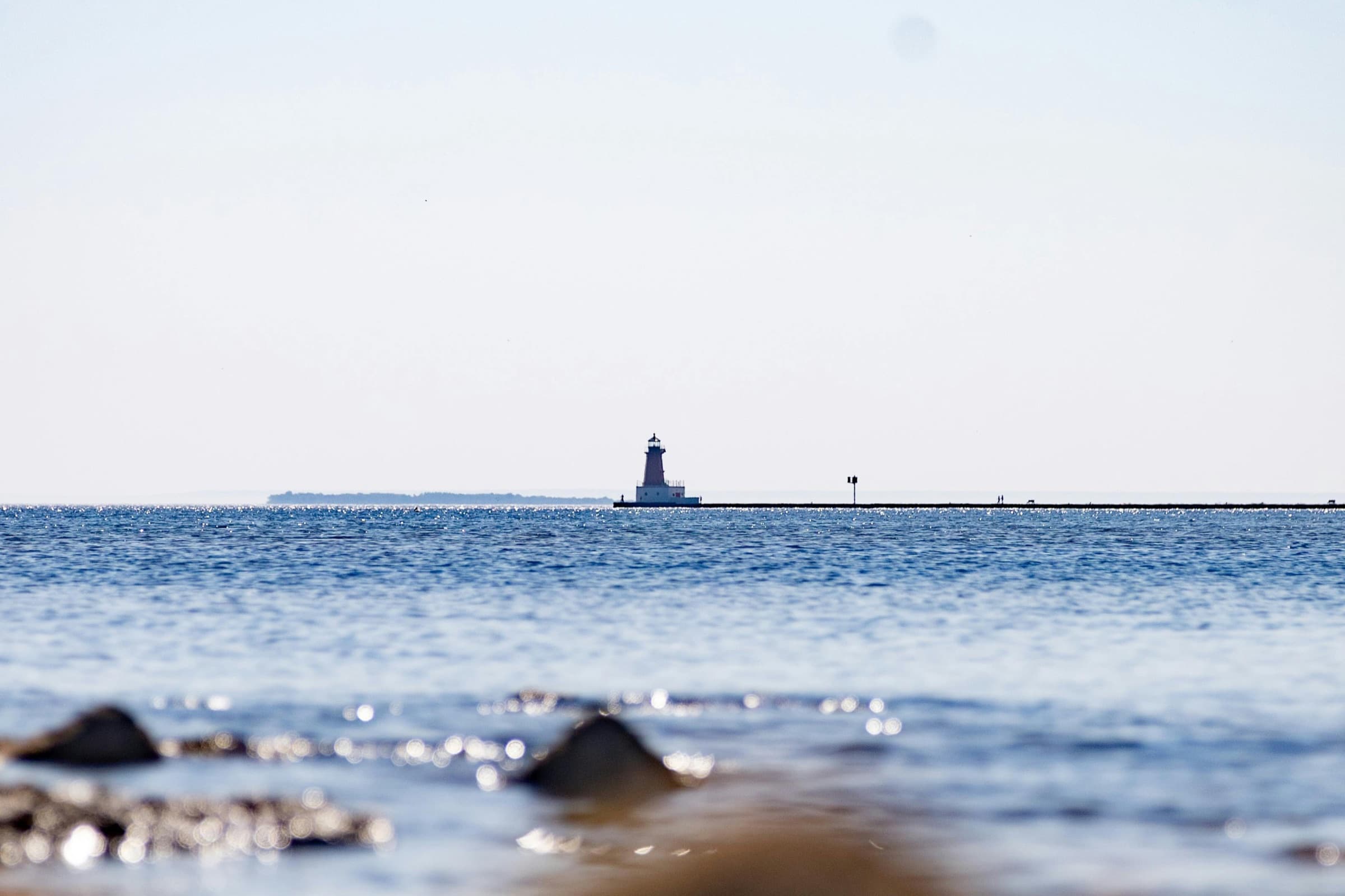 A lone Great Lakes lighthouse on the horizon